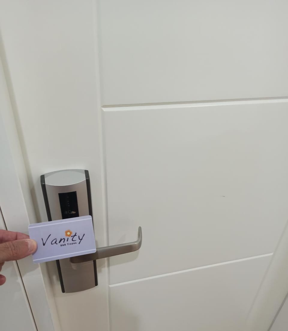 Shower, rainfall showerhead, designer toiletries, hair dryer