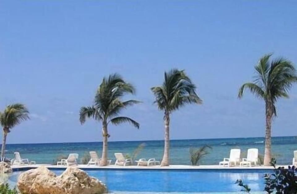 a swimming pool with an ocean view
