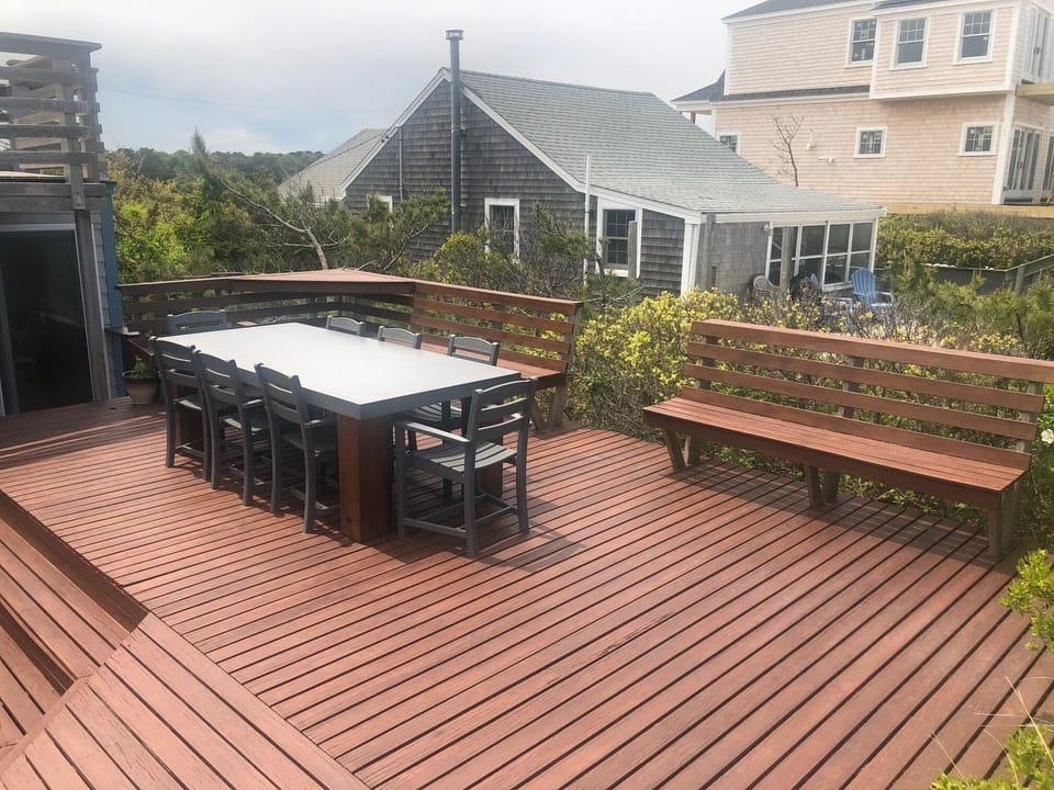 expansive decks also include an upper  seating area 