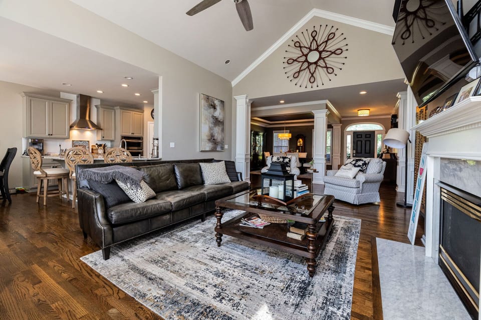 Open concept family room flows right into eat-in kitchen with bar seating too! 