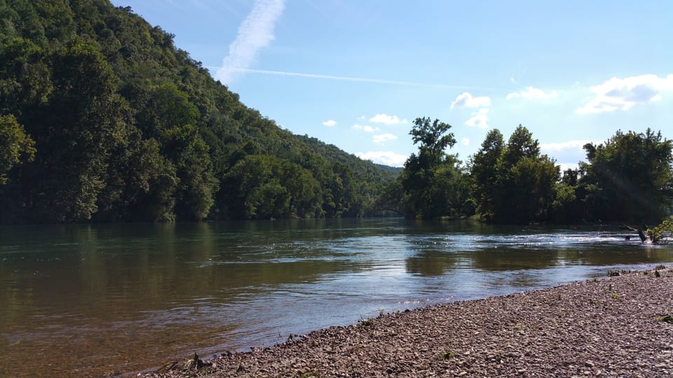 Rocky beach not always visible due to fluctuating river levels.