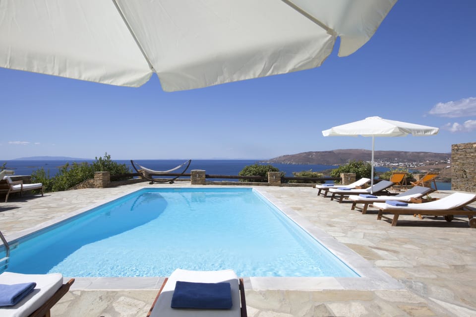 Swimming pool area and sun loungers