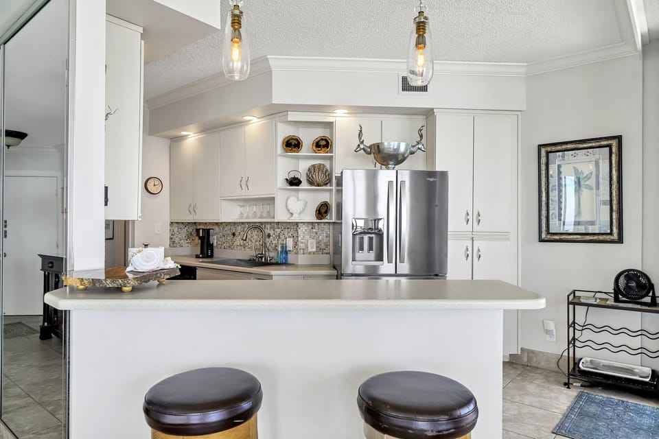 Kitchen prep area overlooks the living room so you can watch TV & enjoy the view