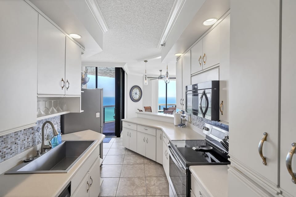 Walk-through kitchen provides ease of access throughout the entire condo