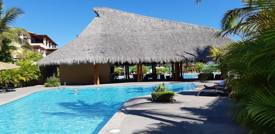 Relax in the shade or bbq under the palapa