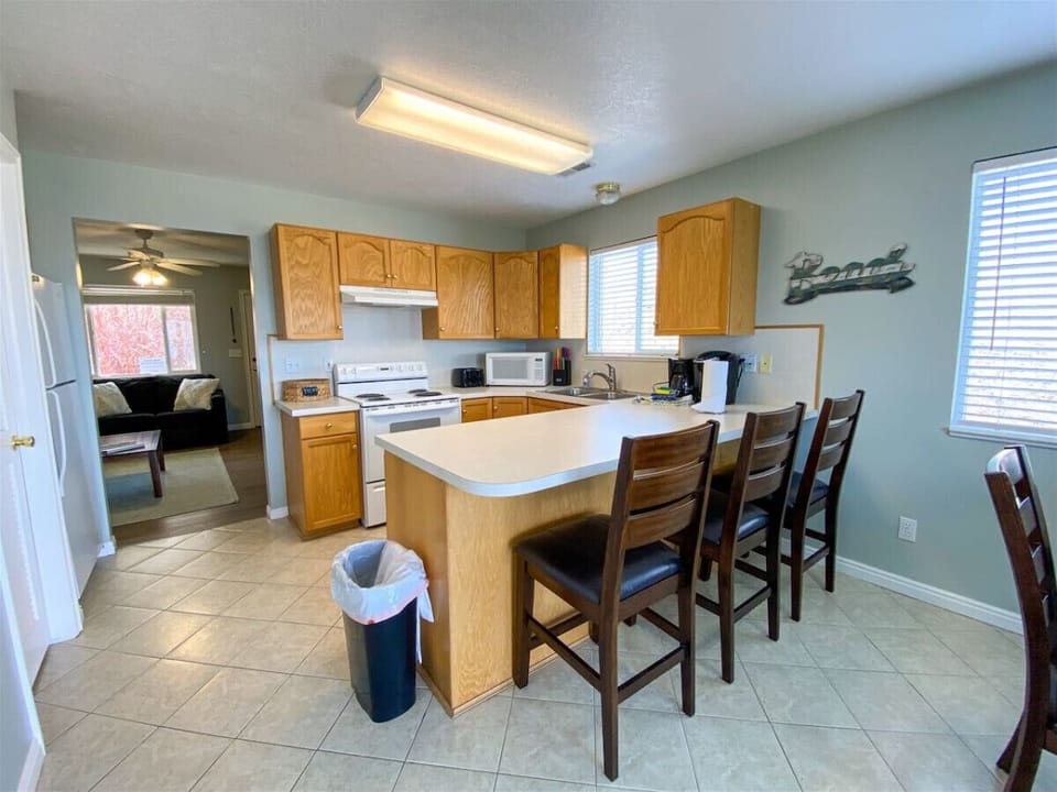 Spacious kitchen with breakfast bar and seating for casual dining