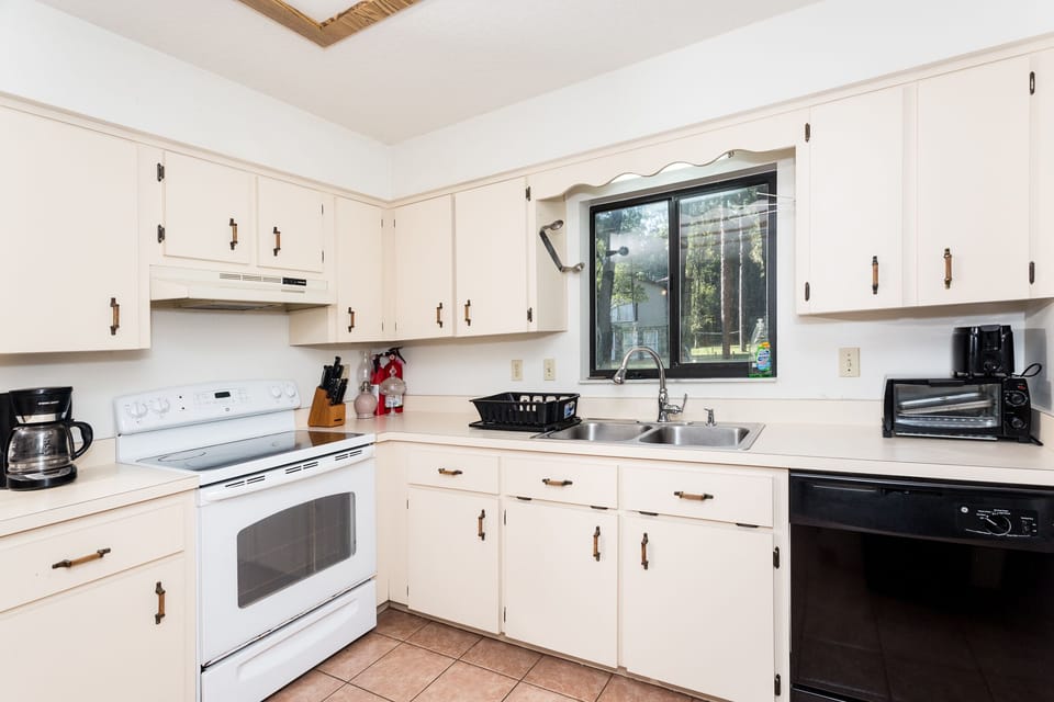 Kitchen includes oven with range, fridge, double sink, dishwasher and more!