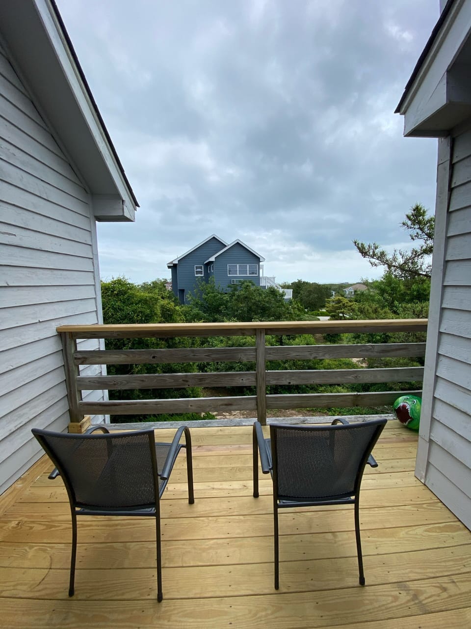 Rear balcony. Beach on horizon is across the road.