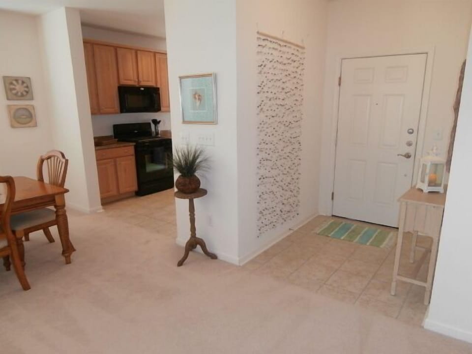 Foyer- Carpet is gone.  New Flooring throughout the entire condo.