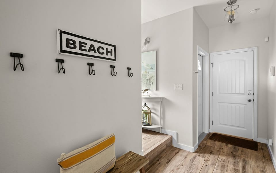 Entry & Front Door — 'BEACH' Sign, Anchor Hooks, Bench, Pelican Art & Lantern Shelf