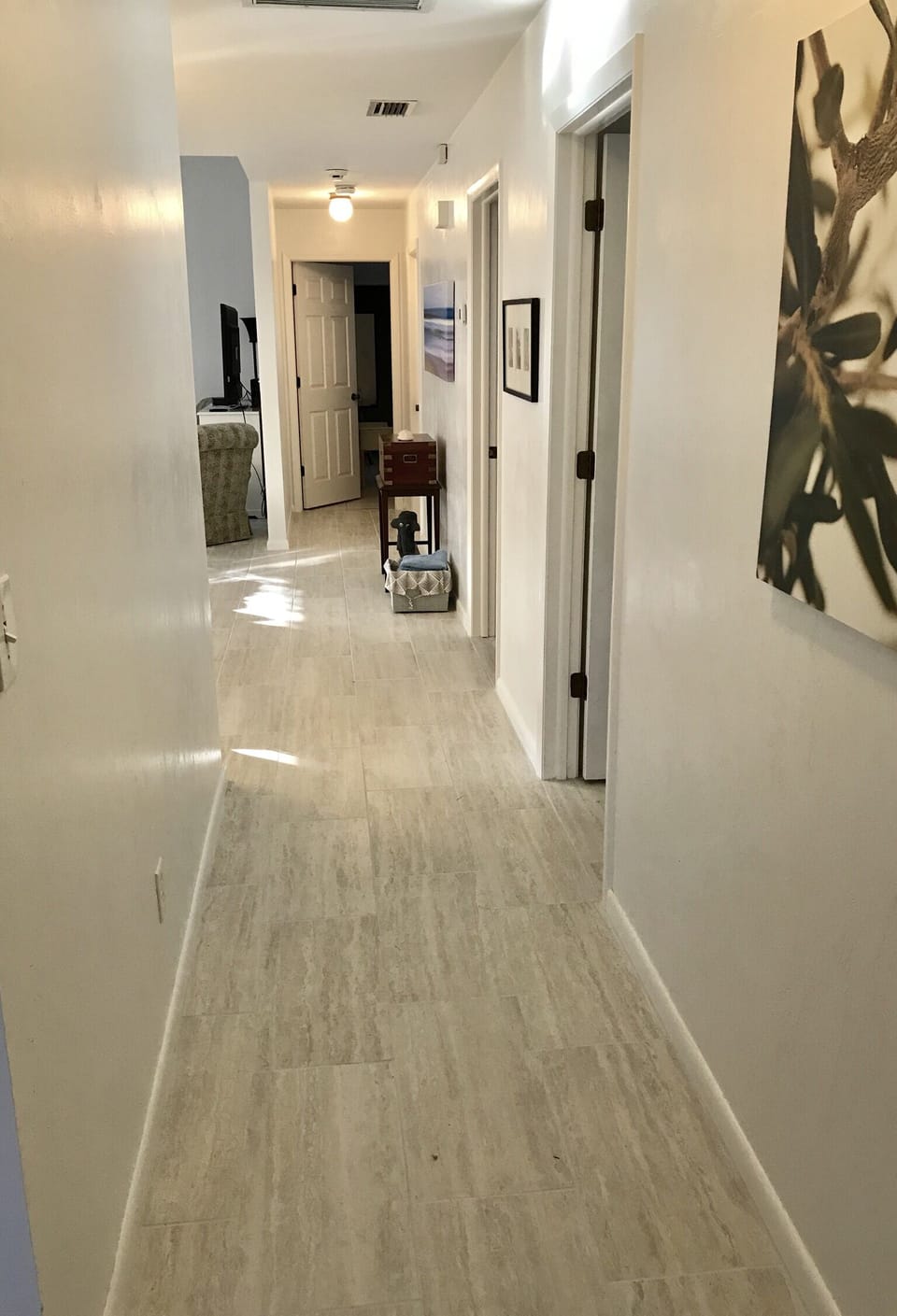 front hallway- updated porcelain floor tile throughout the house