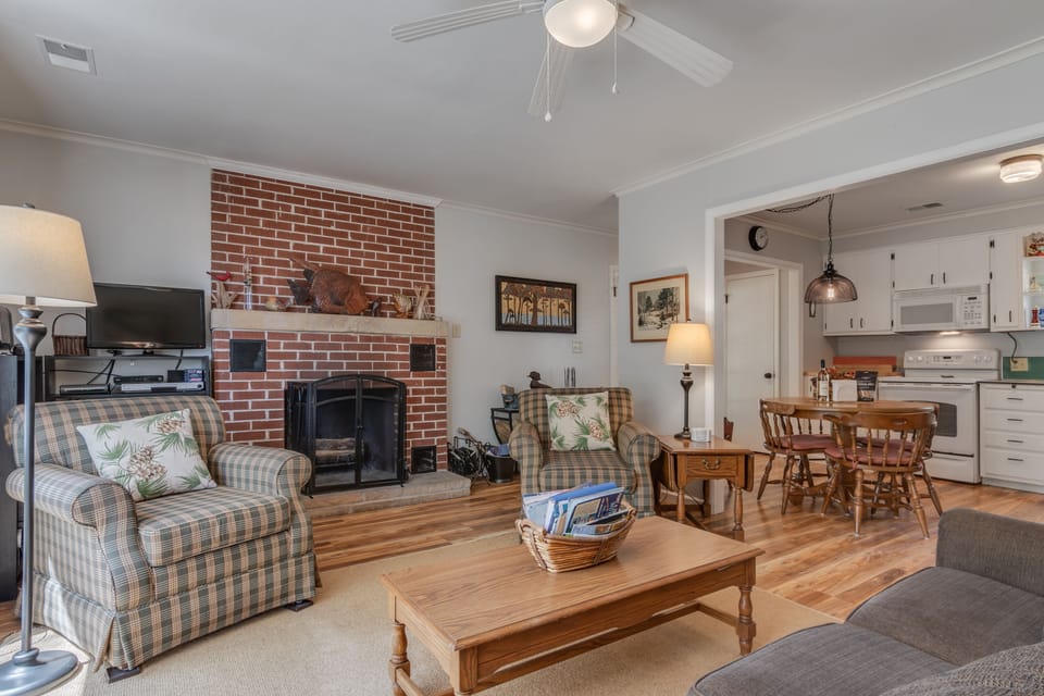 Living Room features cozy wood burning fireplace