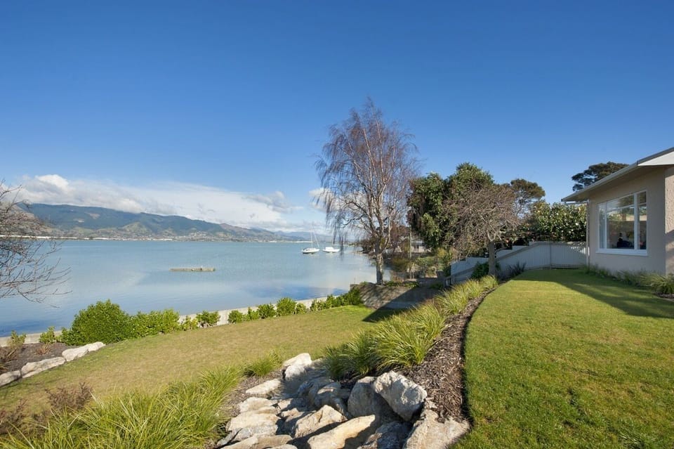 Landscaped terraced lawns lead you down to the waters edge
