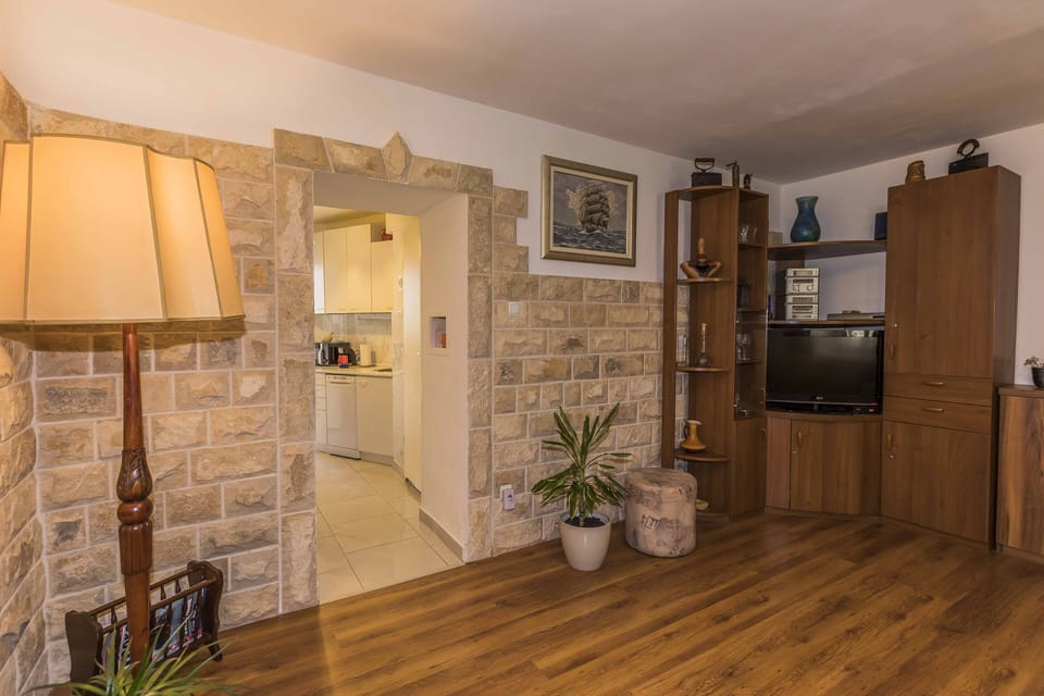Renovated living room with a look to kitchen