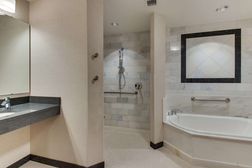 Suite, 1 King Bed with Sofa bed, Accessible (Sofa Sleeper, Roll-in Shower, 2 Rooms) | Bathroom | Shower, free toiletries, hair dryer, towels