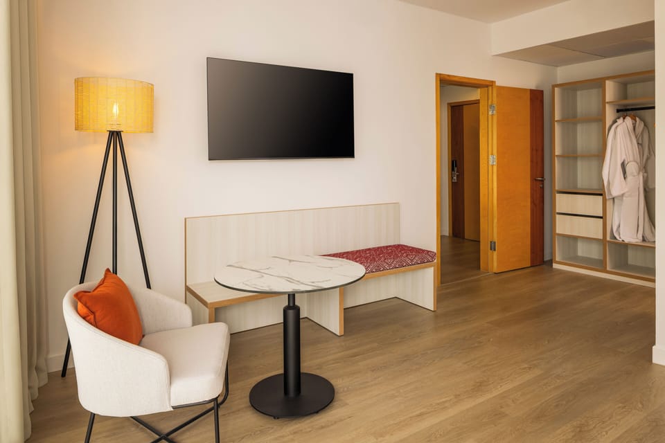 Suite, 1 Bedroom, Balcony | In-room safe, iron/ironing board, free WiFi, bed sheets