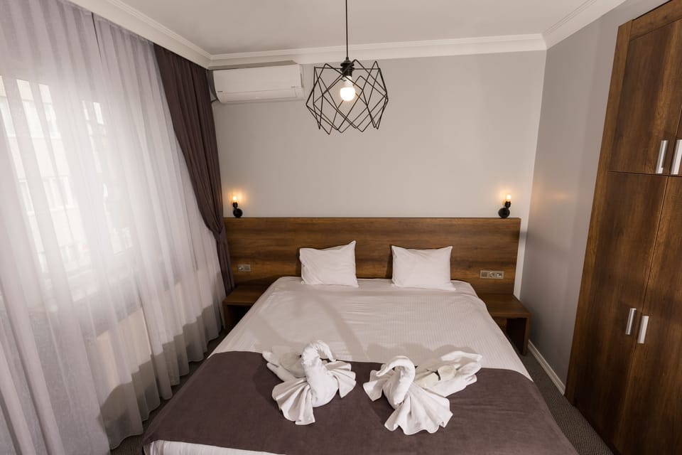 Superior Triple Room | 1 bedroom, desk, laptop workspace, blackout drapes