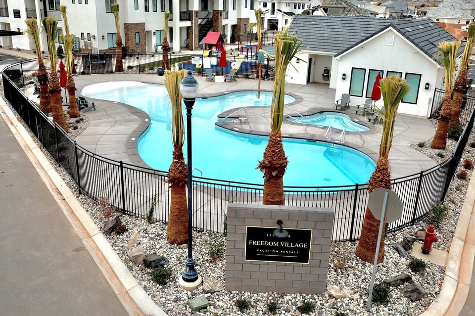 Beautiful shared pool area with seating, perfect for relaxing and family fun.