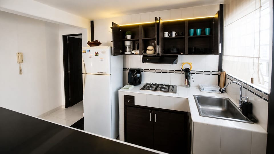 Full-size fridge, microwave (on request), oven, stovetop
