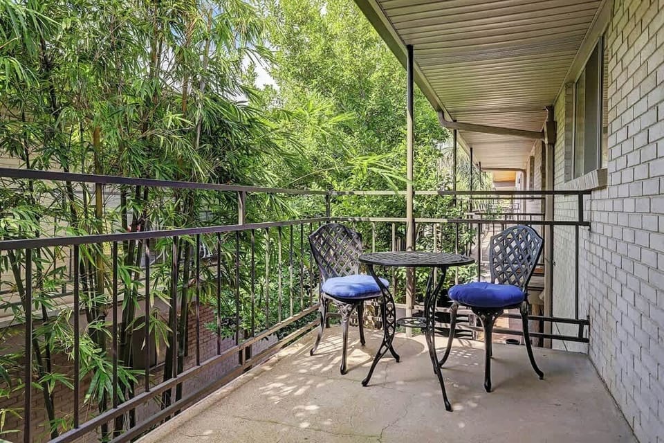 Semiprivate Patio area in a Bamboo Forest with bistro table and chairs. 