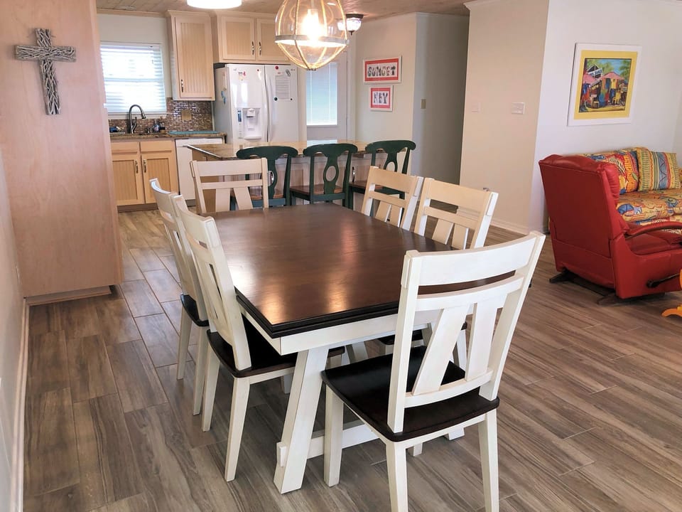 Gather around this spacious dining table where your group can share memorable meals together in comfort and style.