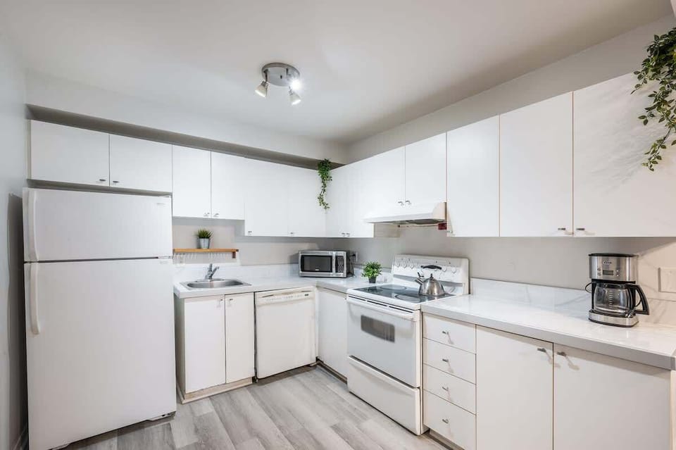 kitchen with dishwasher and marble counter