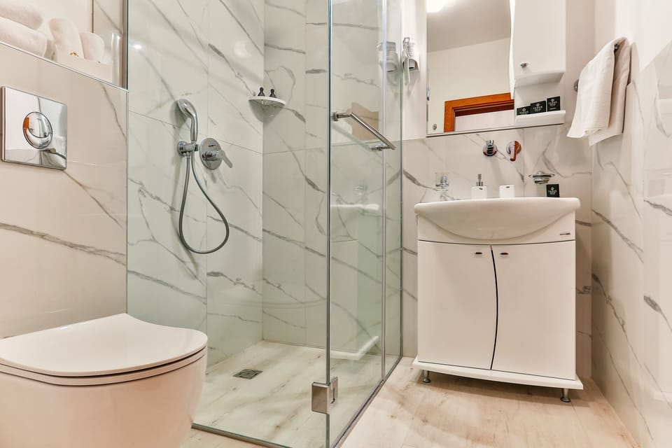 Family Quadruple Room, Multiple Beds, Non Smoking, City View | Bathroom | Shower, hair dryer, towels