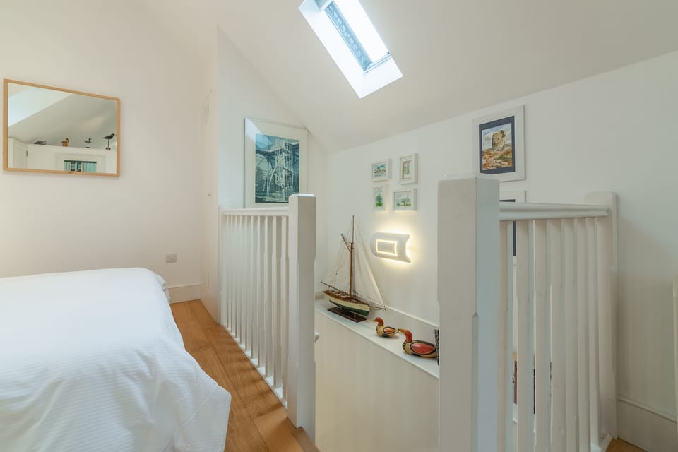 First floor: Stairs leading down to the ground floor