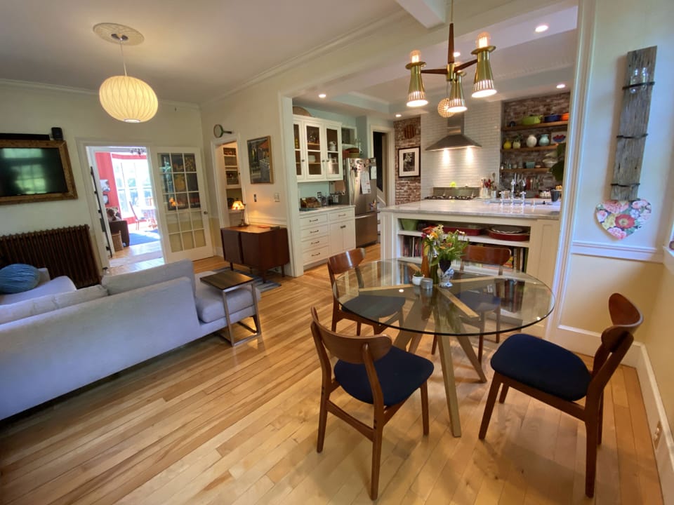 Breakfast nook and kitchen. Downstairs bathroom is through pantry mid-picture