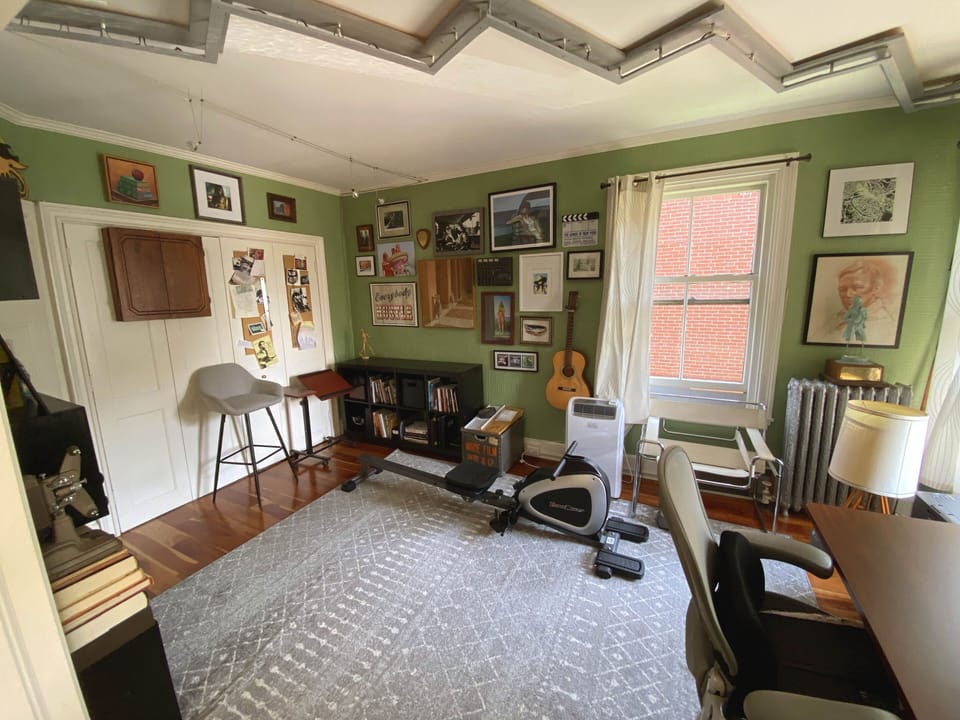 Standing air conditioner helps make this a good space to work, or work out