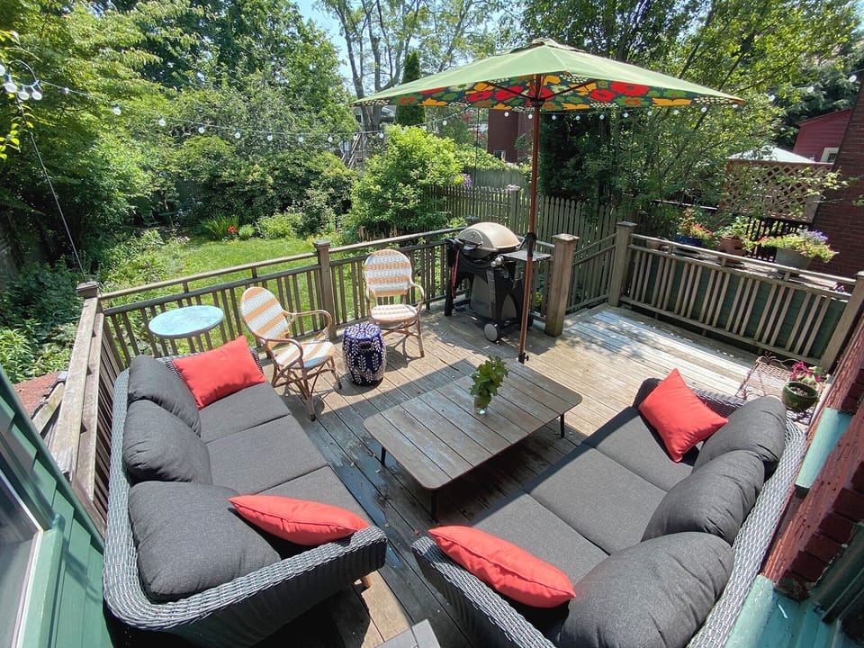 Deck overlooking garden - Gas grill makes for many an easy summer meal outdoors