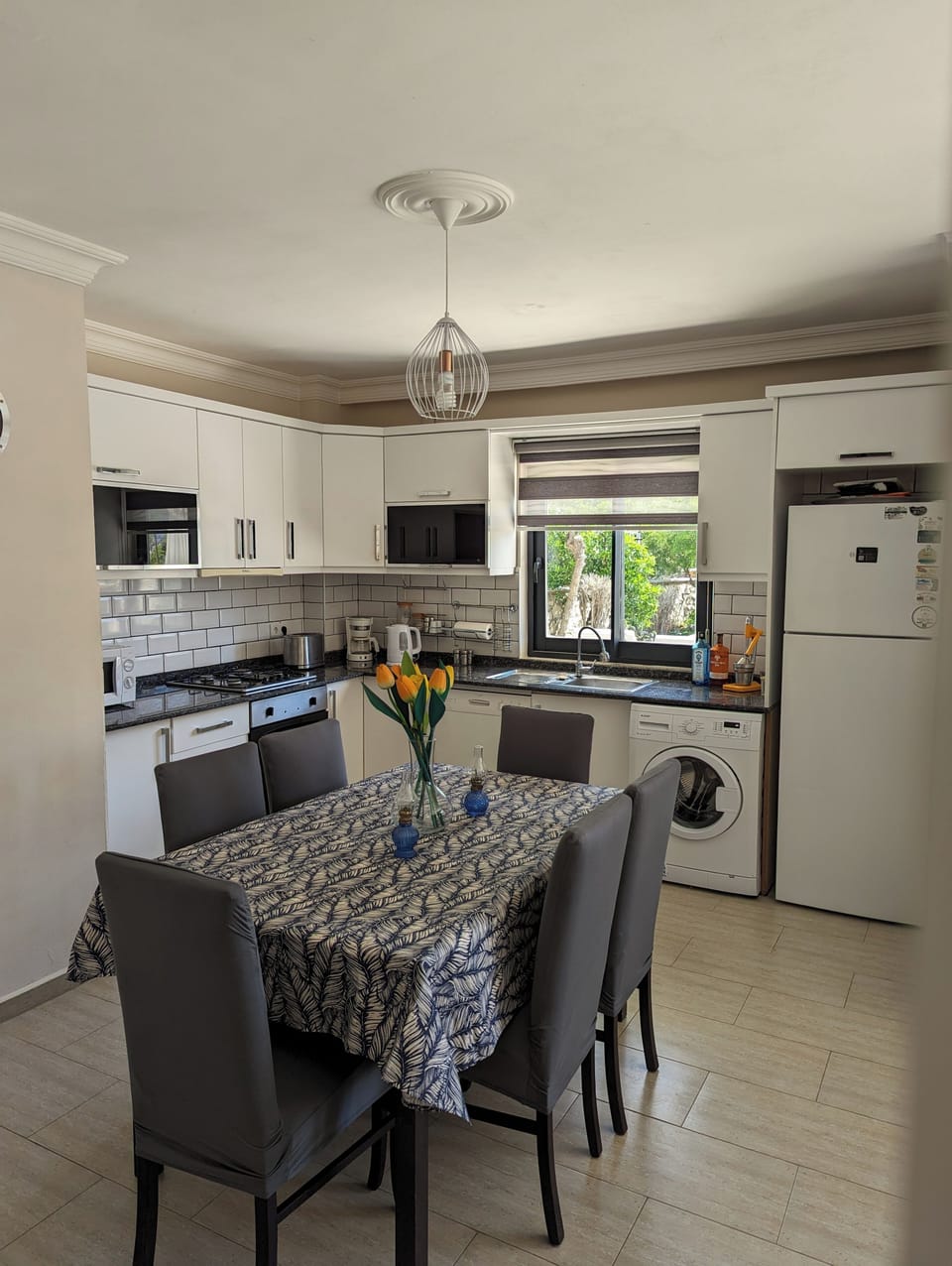 Modern kitchen with extending indoor dining table