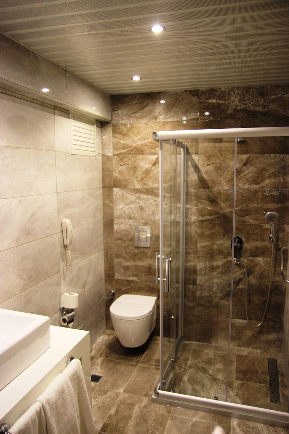 Shower, free toiletries, hair dryer, slippers