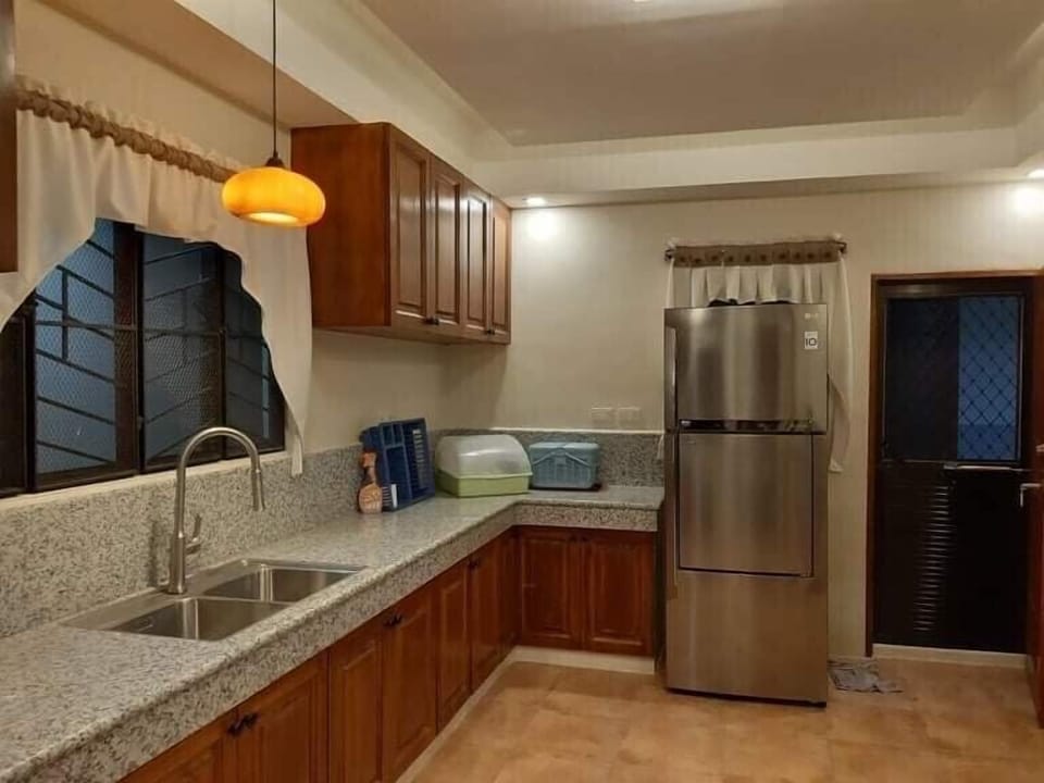 Kitchen with full size refrigerator 