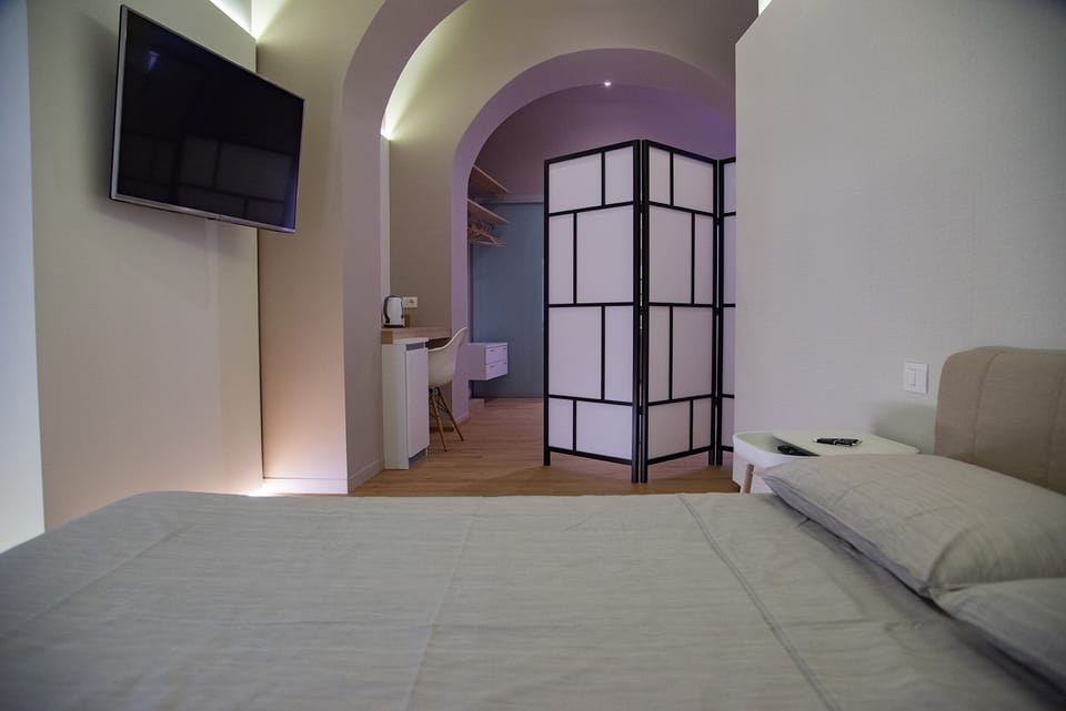 Family Quadruple Room | Down comforters, memory foam beds, minibar, in-room safe