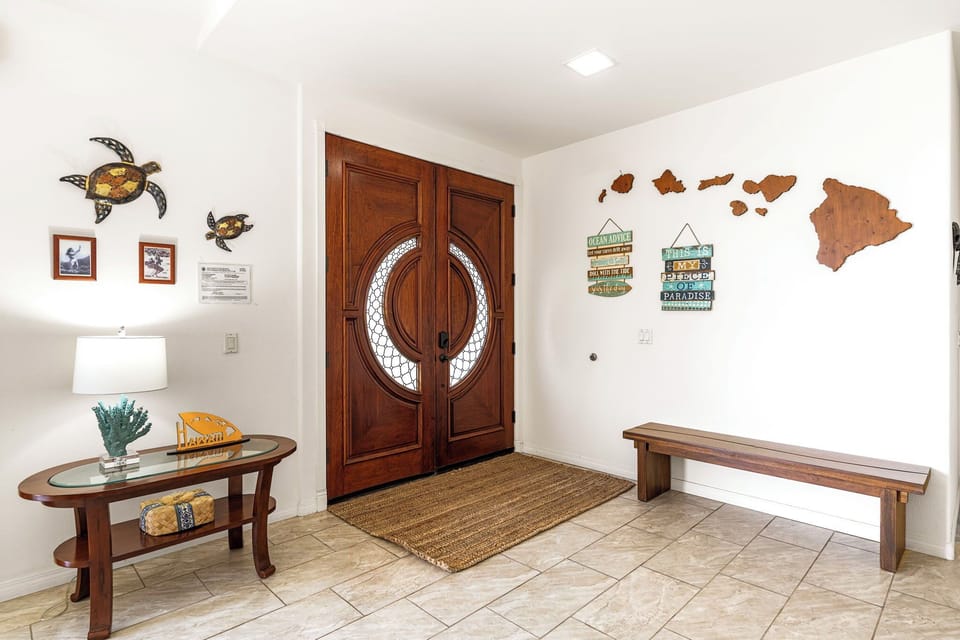 Step into your Hawaiian retreat through this welcoming entrance, where island-inspired décor and warm wood accents set the tone for your tropical getaway.