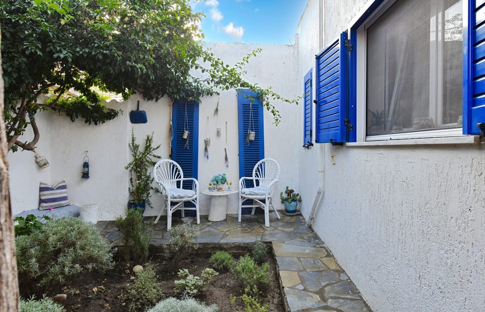Small garden with a seating area in the backyard.