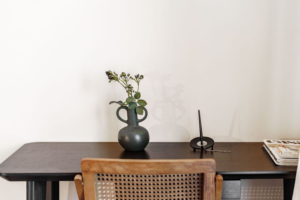 Minimalist table with decorative vase