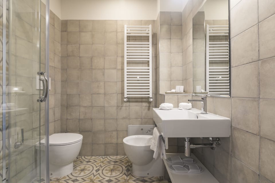 Shower, free toiletries, hair dryer, slippers