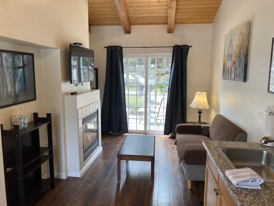 One Bedroom, 1 King Bed, Cottage | Living area | Flat-screen TV