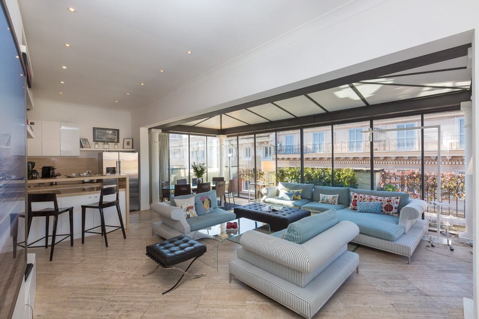 Apartment, 4 Bedrooms | Living area | Flat-screen TV