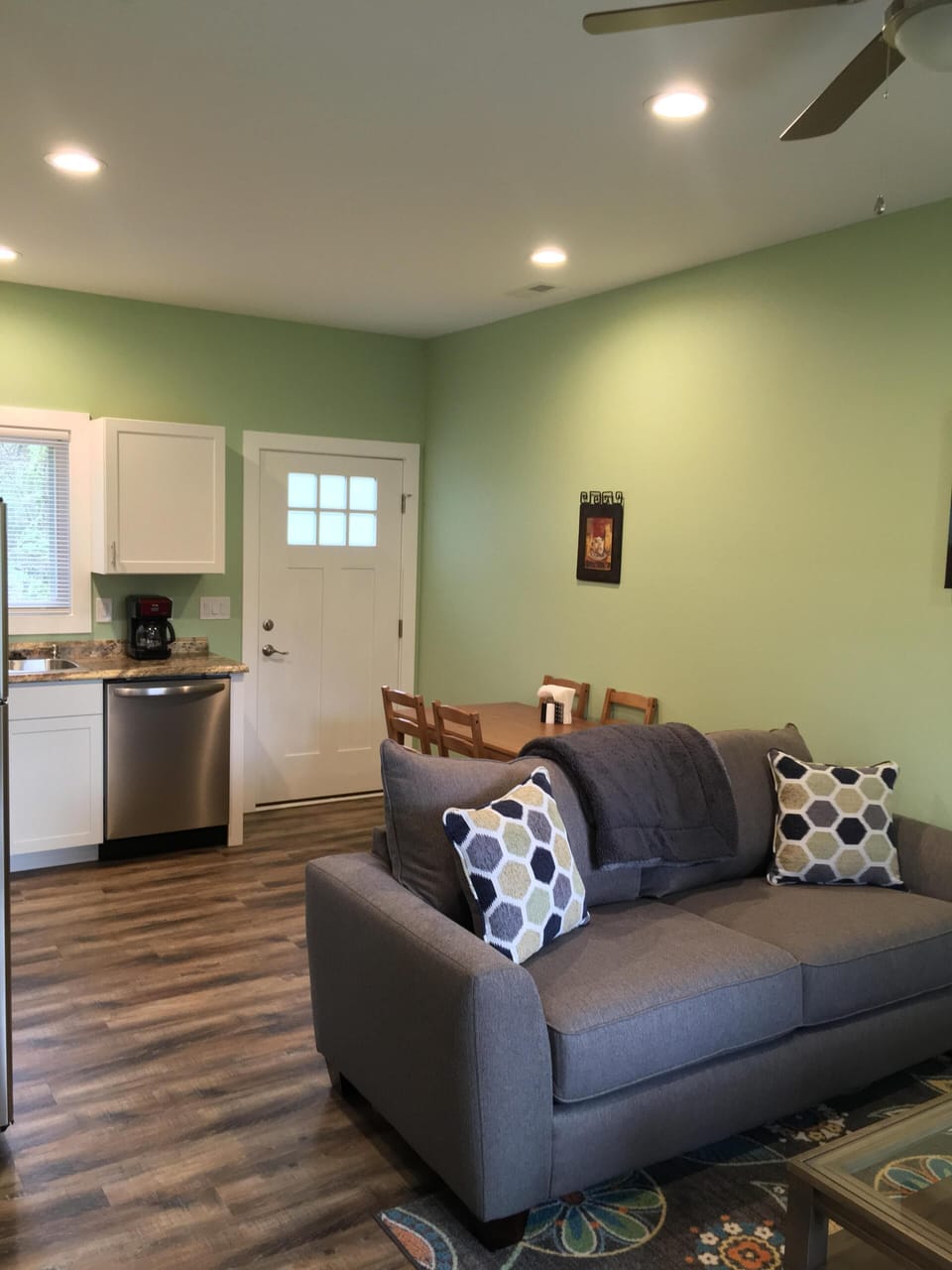 Great room with living room, dining area and kitchen.