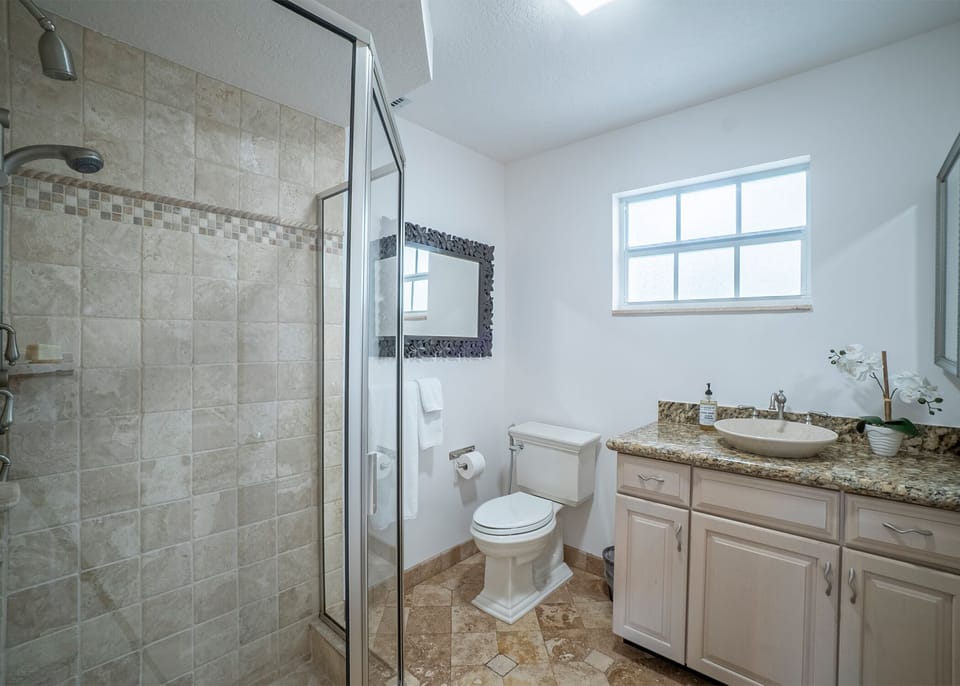 The cabana full bathroom with all necessary amenities plus plush white towels.