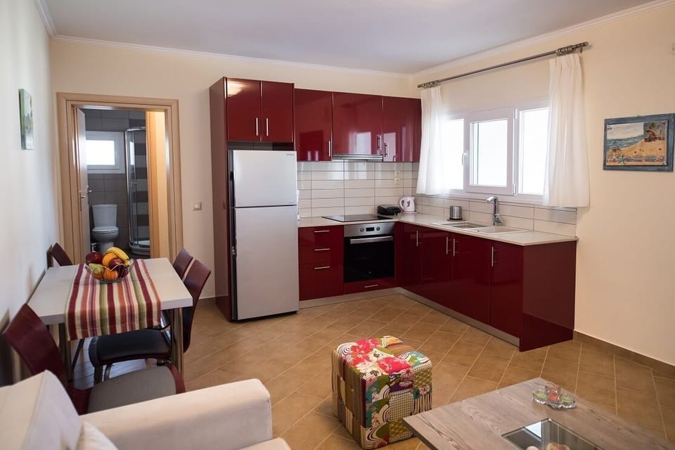 Apartment, 1 Bedroom, Garden View | In-room safe, desk, soundproofing, iron/ironing board