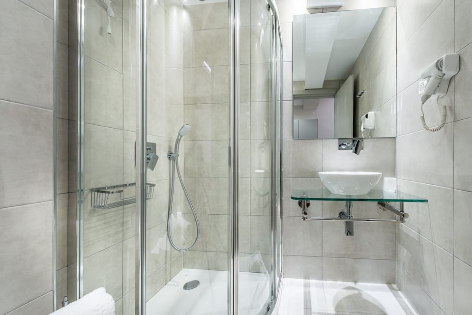 Shower, rainfall showerhead, designer toiletries, hair dryer