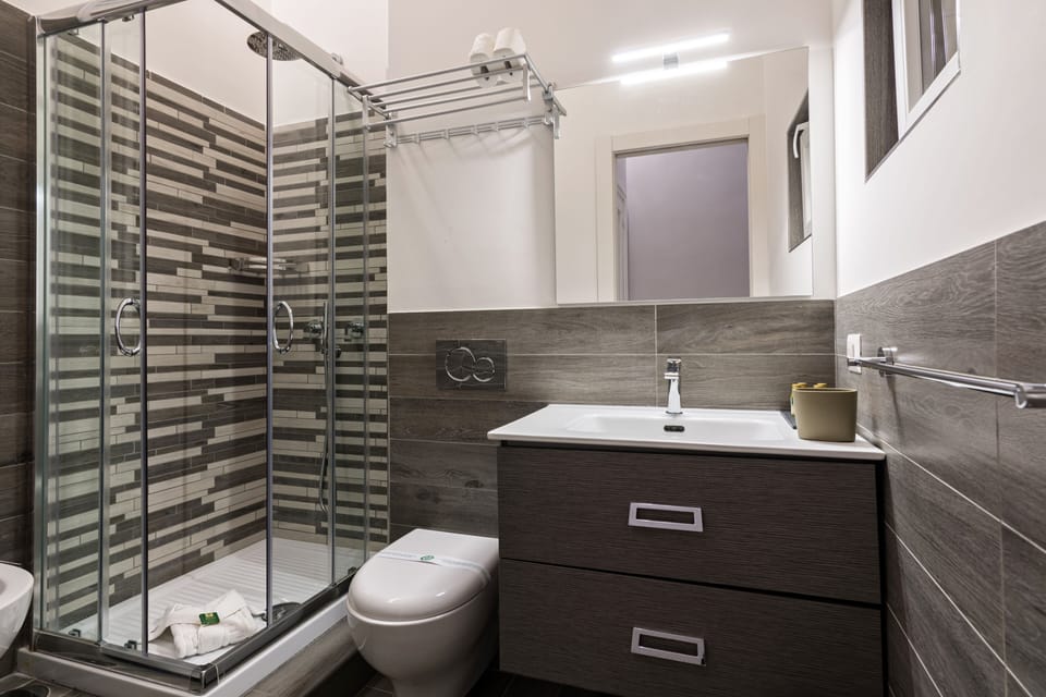 Family Loft, City View | Bathroom | Shower, rainfall showerhead, hair dryer, bidet