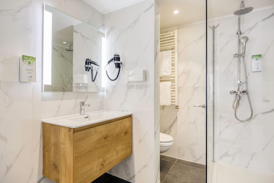 Shower, rainfall showerhead, hair dryer, towels