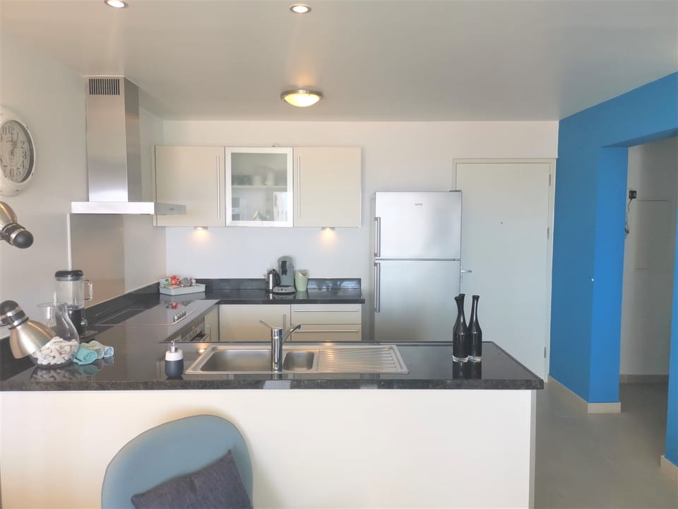 the living room with open kitchen