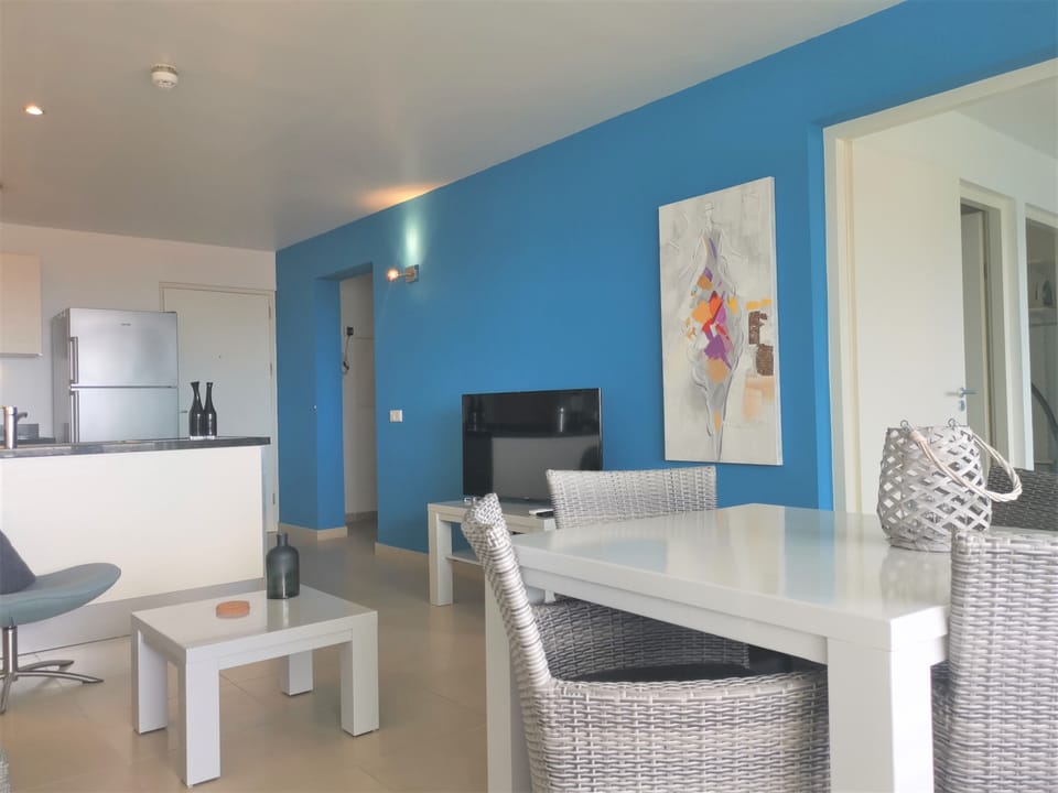 the living room with open kitchen