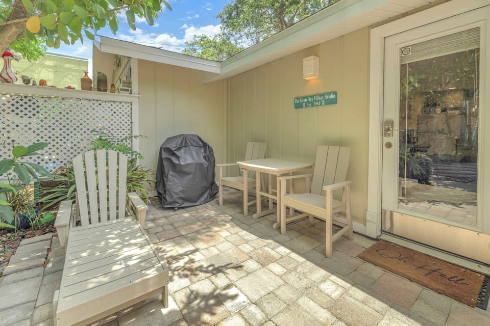 Private patio with seating and propane grill.